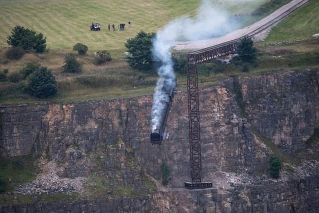 A taste of Hollywood came to Derbyshire when the team behind Mission Impossible 7 - including actor Tom Cruise - filmed a train crash scene at the former Darlton Quarry in Stoney Middleton. Derbyshire photographer Villager Jim captured the dramatic moment the train went over the edge. The film is in cinemas now 