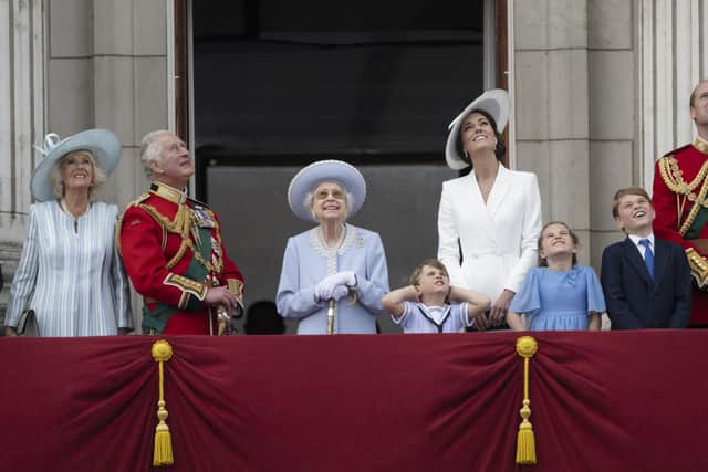 From left, Camilla, Duchess of Cornwall, Prince Charles, Queen Elizabeth II, Prince Louis, Kate, Duchess of Cambridge, Princess Charlotte, Prince George and Prince William gather on the balcony of Buckingham Palace, London, Thursday, June 2, 2022 as they watch a flypast of Royal Air Force aircraft pass over as part of  the Queen's Platinum Jubilee celebrations