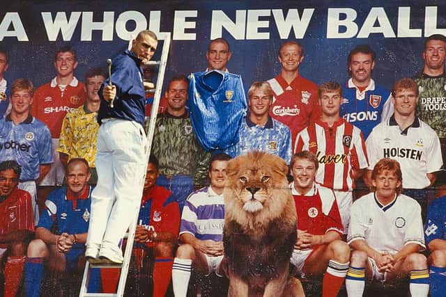 Wimbledon player Vinnie Jones nails a Wimbledon shirt to his image on a bill board promoting the first Premier League season in July 1992.