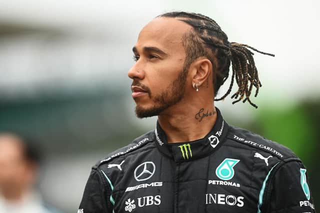 Lewis Hamilton of Great Britain and Mercedes GP looks on as the prototype for the 2022 F1 season is unveiled during previews ahead of the F1 Grand Prix of Great Britain at Silverstone on July 15, 2021 in Northampton, England. (Photo by Michael Regan/Getty Images)