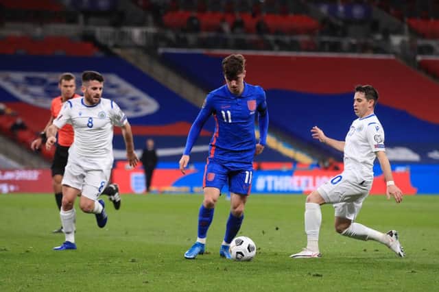 Mason Mount of England is challenged by Adolfo Hirsch of San Marino during the FIFA World Cup 2022 qualifying match.