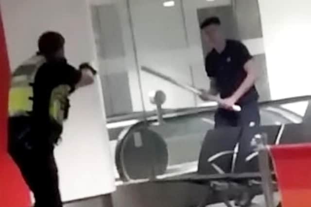 The moment a man was tasered at a train station following the England v Germany game after he began waving around a metal bollard (Photo: Birmz is Grime / SWNS)