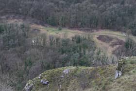 The Peak District National Park Authority and a former Dragons' Den star have been in a stand-off over unauthorised work on 'ecologically sensitive' areas of the park.