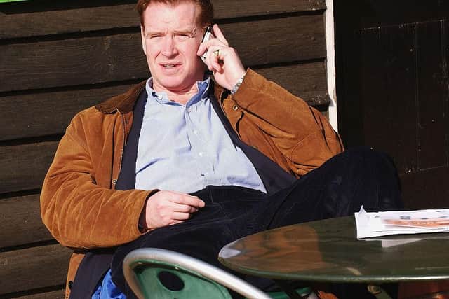 Hewitt pictured in 2004 taking a call on his mobile in Hyde Park (Photo: Steve Finn/Getty Images)
