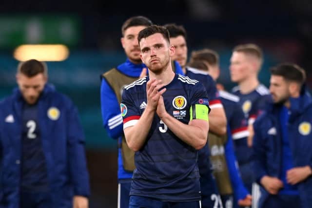 A gutted Andy Robertson of Scotland applauded the fans following the defeat (Picture: Getty Images)