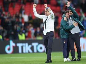 Italy's coach Roberto Mancini celebrates after winning the UEFA EURO 2020 semi-final football match between Italy and Spain at Wembley Stadium.