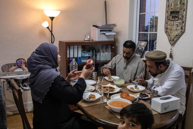 A family sit down to the fast-breaking meal of Iftar, which is eaten before the Maghrib, the fourth prayer of the day (Photo: Dan Kitwood/Getty Images)