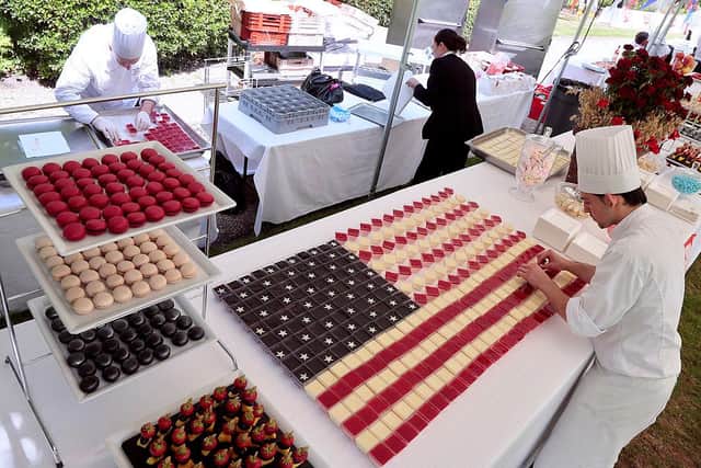 Cooks prepare "Stars and Stripes" desserts, fashioned as the US national flag, for a buffet, on July 4 (Picture: GettyImages)