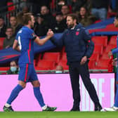 Harry Kane of England shakes hands with Gareth Southgate. (Photo by Clive Rose/Getty Images)