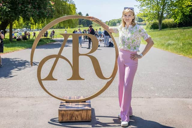 Fiona Bruce with the Antiques Roadshow logo. Photo by BBC.